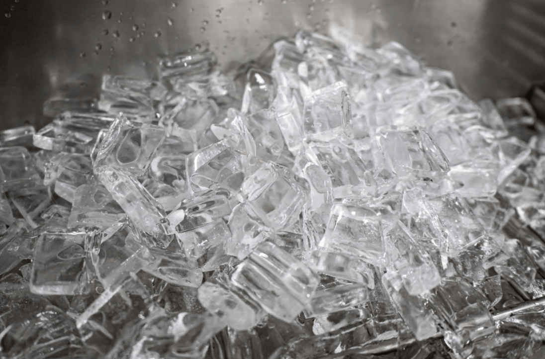 ice dumped in bin of commercial ice maker